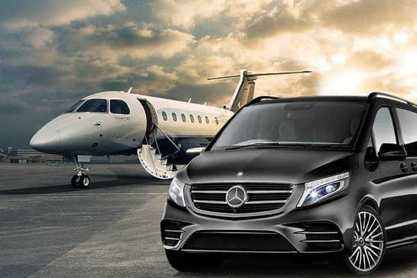 Mercedes-Benz V-Class beside a private jet on an airport apron