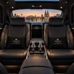Premium Mercedes-Benz passenger cabin with black leather seats, ambient lighting and Black Van Cologne accessories
