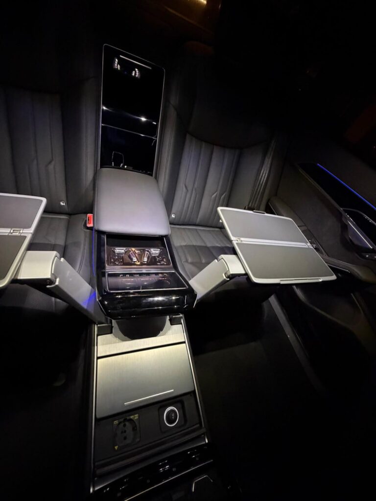 Rear passenger compartment with folding tables